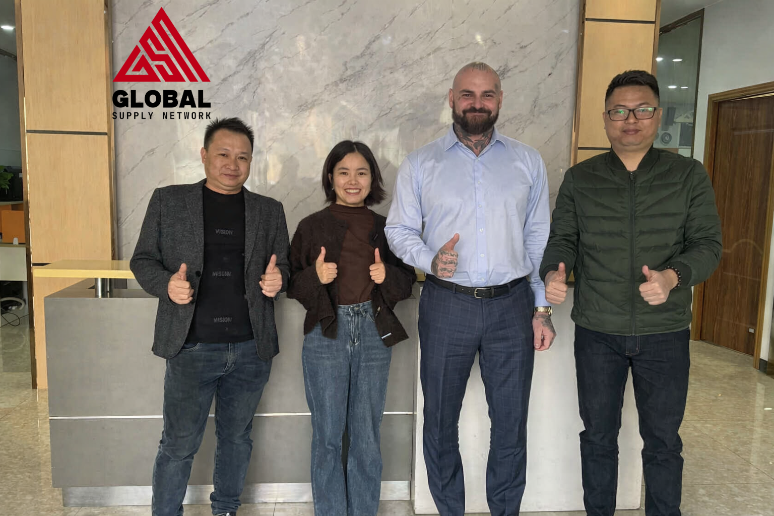 Chris Perfetti with the injection moulding supplier team after a tooling and process review for Global Supply Network, China, 2024.