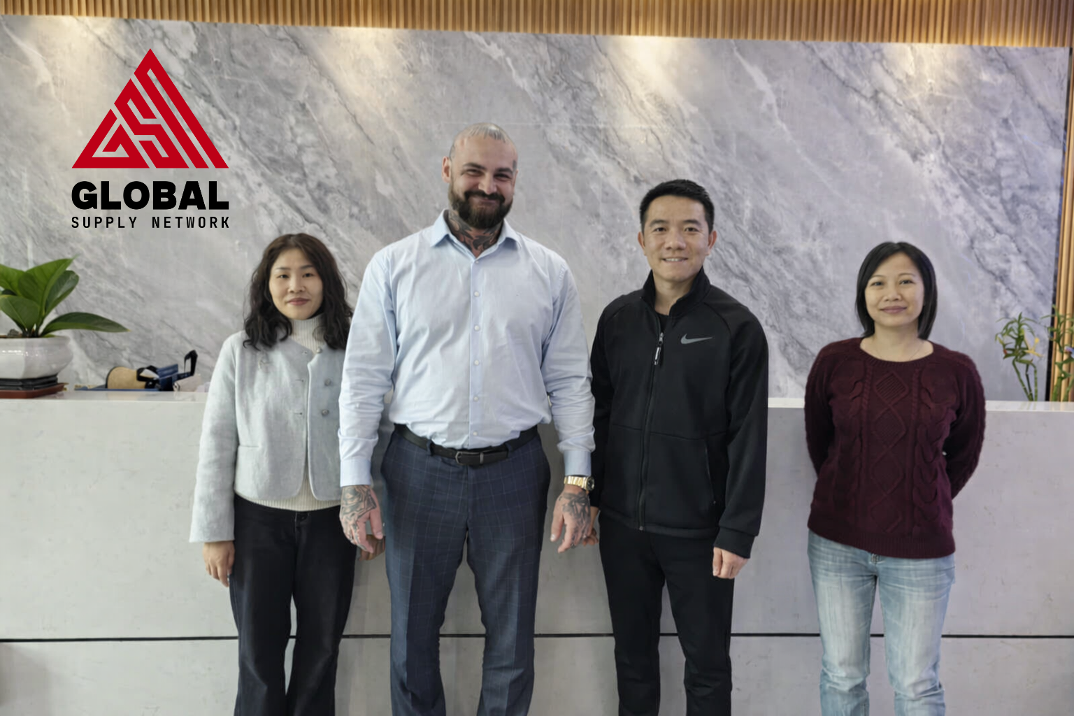 Chris Perfetti with prototyping factory team in Dongguan, China, 2024, Global Supply Network site visit covering SLA, SLS and CNC prototype workflows.